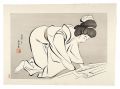 Woman folding a Kimono
